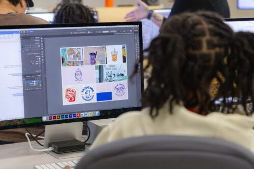 Student working on a moodboard in Adobe Illustrator